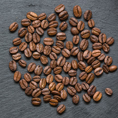 coffee beans (good and bad grain) - arabica and robusta blend (roasted coffee grain). Black background. Top view . Copy space.
