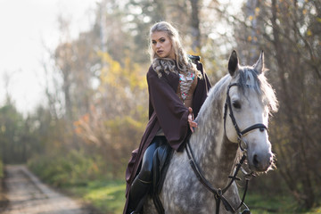 Obraz premium Young woman with a horse