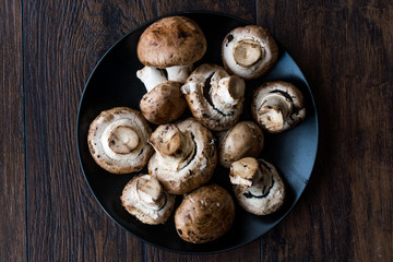 Portobello Raw Cremini Mushrooms in Black Plate.