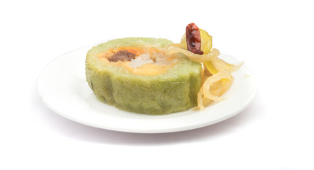 Vietnamese sticky rice with pork and egg Banh tet. They are rice and minced bean mix with boiled pork and egg, then wrapped in banana leaves, and cooked in hot water. You can eat along with cabbage or