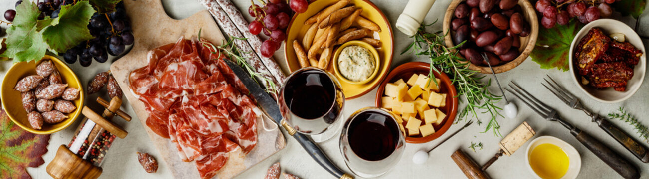 Wine And Tapas On Concrete Background, Top View