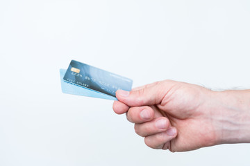 secure shopping with credit card. easy checkout and money management. man hand holding plastic card.