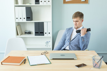 Naklejka premium Office, fitness and people concept - Business man working and doing sport at her office