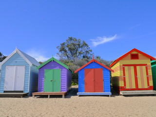 Fototapeta na wymiar front view on colourful beach huts in Brighton, Melbourne, Victoria, Australia