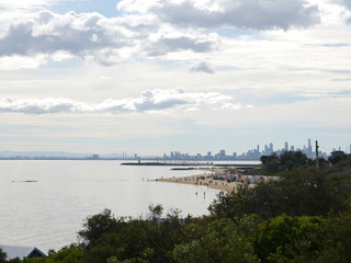 Fototapeta na wymiar panorama of Melbourne's skyline with Brighton Beach and St Kilda