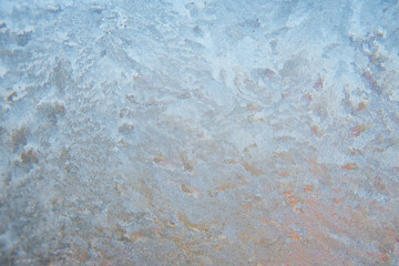 Winter background, frozen glass from strong frost, ice texture on the window