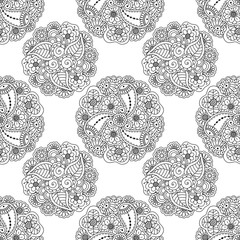 Vector seamless pattern of decorative black floral mandalas on white background. Coloring book page anti stress background