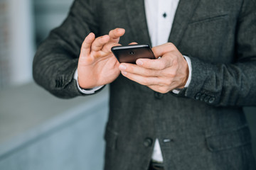 communication technology. business man texting or messaging partners using mobile phone