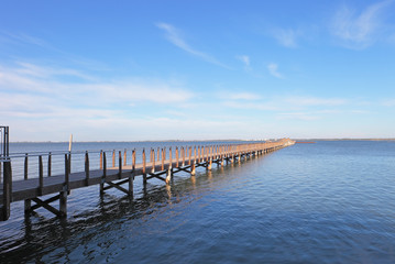 Fototapeta premium Beautiful lagoon and the long over water bridge of Lesina, Apulia, Italy