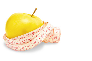 A yellow tape with a yellow apple on a white background. Isolate