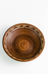 pots and plates of clay on a white table and a blue background. clay pottery kitchen utensils made by hand. red clay tableware