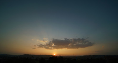 Beautiful sunset sky above clouds with dramatic light.