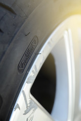 Close up view on the rim protection feature at the sidewall of a high perfomance car tire mounted...