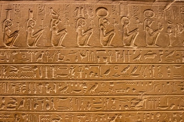Old egypt hieroglyphs carved on the stone.