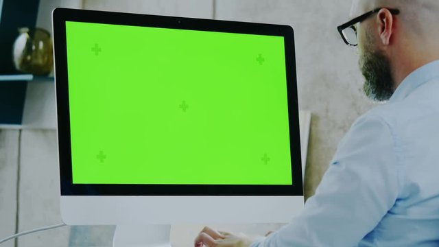 Middle-aged designer working in office