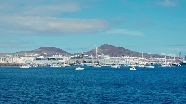 sailing boats are leaving the city marina