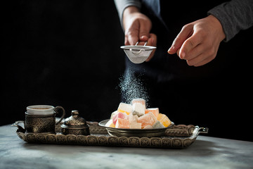 Chef is putting the sugar on the Turkish delight