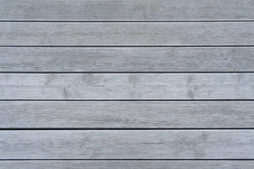 Horizontal gray wooden boards with ribbed surface (texture, background)