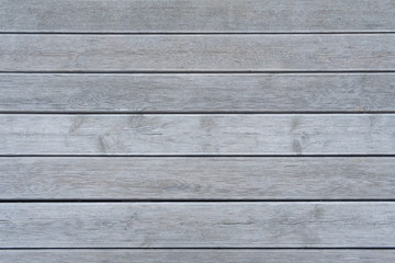 Obraz premium Horizontal gray wooden boards with ribbed surface (texture, background)
