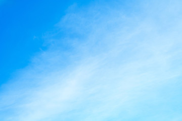 White cirrus clouds in bright azure sky (background)