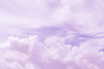 Light lilac soft fluffy clouds in the sky (background, toned)