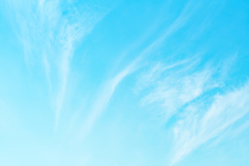 Fototapeta na wymiar Abstract view on a white clouds in bright turquoise sky as background