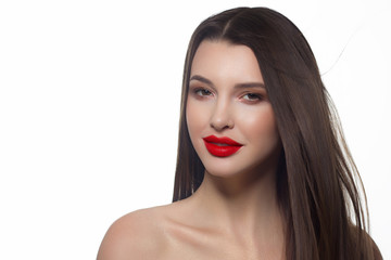 Fototapeta premium Close-up portrait of sexy european young woman model with classic glamour make-up and red lipstick. Dark long hairstyle, christmas makeup, dark eyeshadows, bloody red lips with gloss