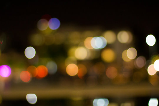 Artistic style - Defocused urban abstract texture ,bokeh of city lights in the background with blurring lights for your design