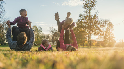 Family with three kids having fun in autumn park © Gajus
