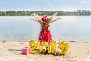 Woman with long hair posing with new year decorations