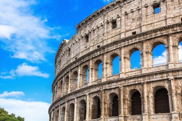 Fototapeta premium Colosseum in Rome against blue sky. Rome architecture and landmark. Italy.
