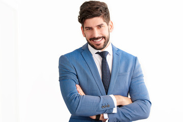 Businessman standing at isolated white background and wearing suit