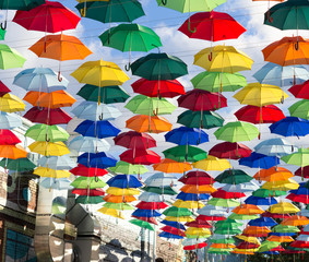 Installation of hanging colored umbrellas