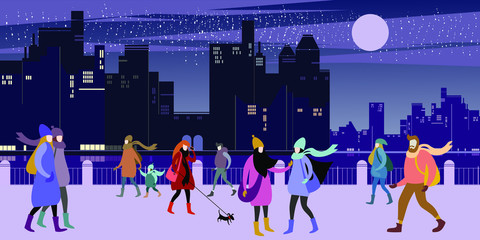 A group of young urban warmly dressed  people walk in the evening winter city quay