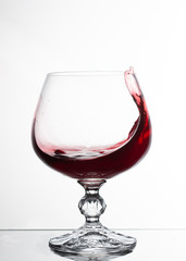 A glass of white wine on white background close up still life image