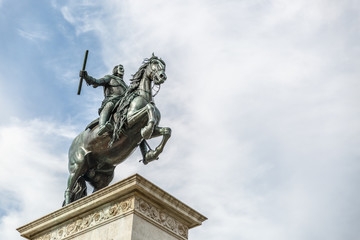 Fototapeta na wymiar Monument to Felipe IV located in the center of Plaza de Oriente in Madrid