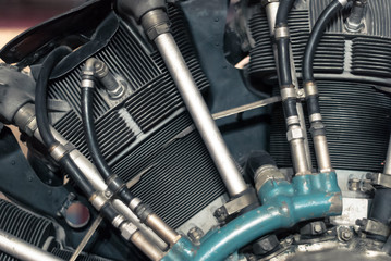fragment of an radial aircraft reciprocating engine, partially blurred background