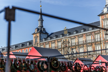 View of a part of the facade of one of the buildings of the Plaza Mayor in Madrid, with booths in the center