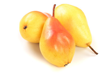 Three ripe red yellow pear fruits isolated on white background.
