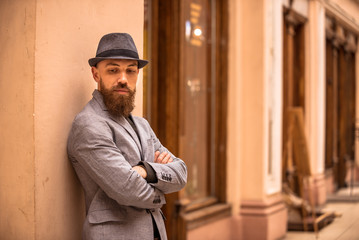 bearded, fashionable man in a hat