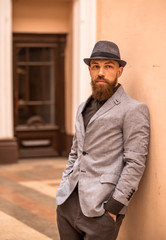 Fototapeta na wymiar bearded, fashionable man in a hat