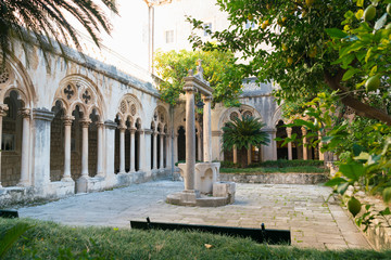 Fototapeta na wymiar Cloister with beautiful arches and columns in old Dominican monastery in Dubrovnik