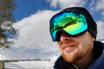 close on a face of a skier with a mask isolated on white background