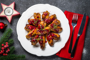Baked chicken wings in cranberry sauce. 
