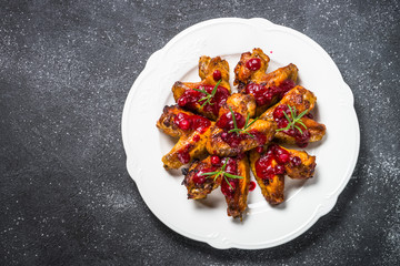 Baked chicken wings in cranberry sauce. 