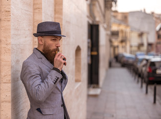 stylish bearded man in bloop wipe habit