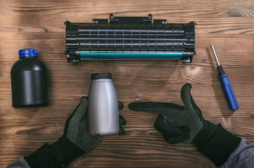 Laser cartridge toner refill concept. Office equipment maintenance concept.