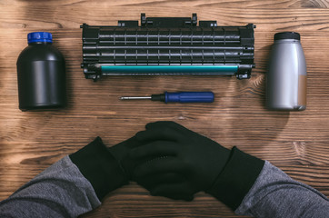 Laser cartridge toner refill concept. Office equipment maintenance concept.