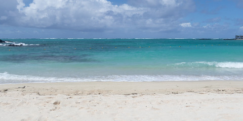 Tropical beach landscape with white sand and blue sea