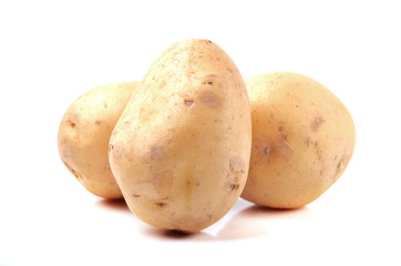 Three raw potatoes isolated on white background